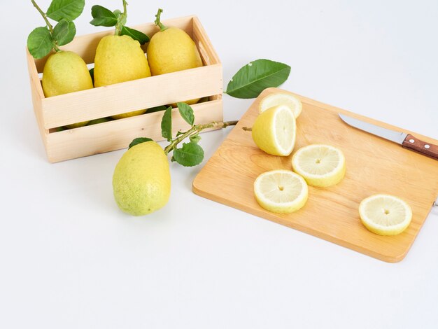 Lemon slices on wooden cutting board