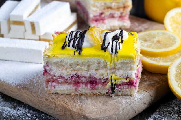 Lemon strawberry cake made of several layers of cakes of different flavors cream and lemon layer sweet and delicious multilayered dessert