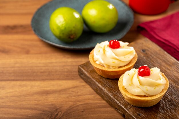 Lemon tartlets decorated with cherry