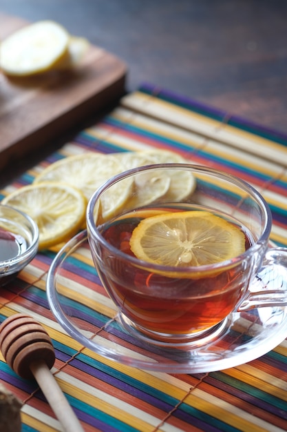 lemon tea and honey on wooden background