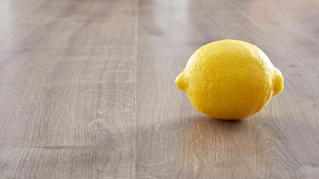 Lemon on wooden background