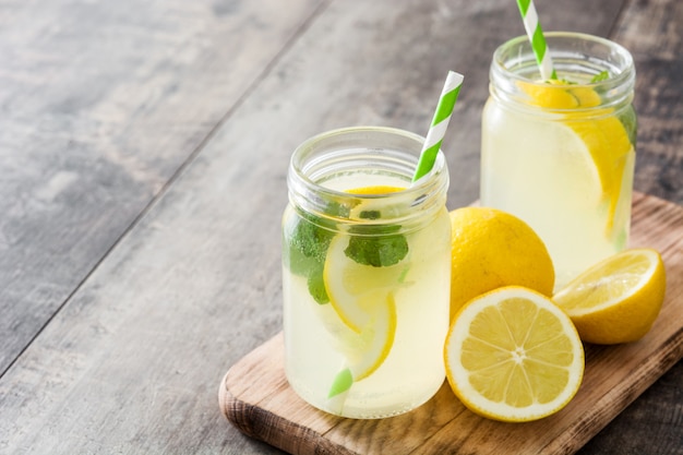 Lemonade drink in a jar glass on wood copyspace