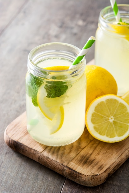 Lemonade drink in a jar glass on wood