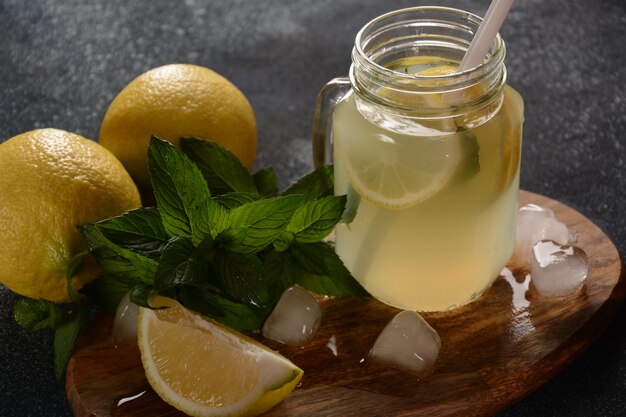 Lemonade or mojito cocktail with lemon and mint with ice