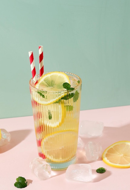 Lemonade or Mojito Cocktail with Sliced Lemon and Mint Leaf Cold Refreshing Drink or Beverage with Ice