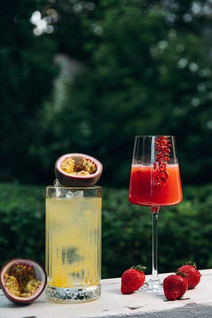 Lemonade or tropical cocktail with passion fruit and Cooling Rossini italian alcoholic cocktail with