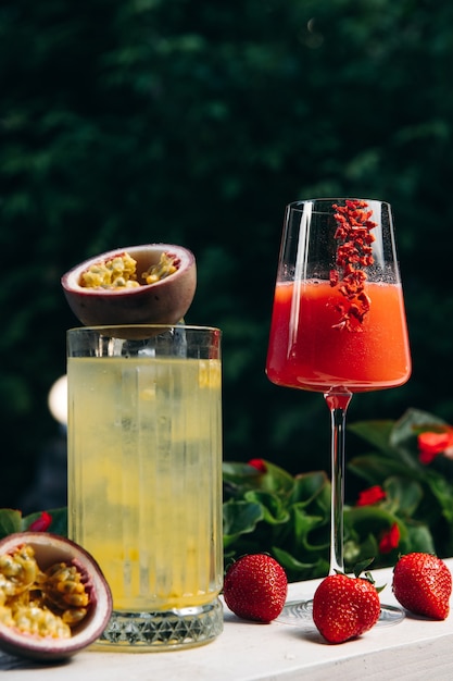 Lemonade or tropical cocktail with passion fruit and Cooling Rossini italian alcoholic cocktail with