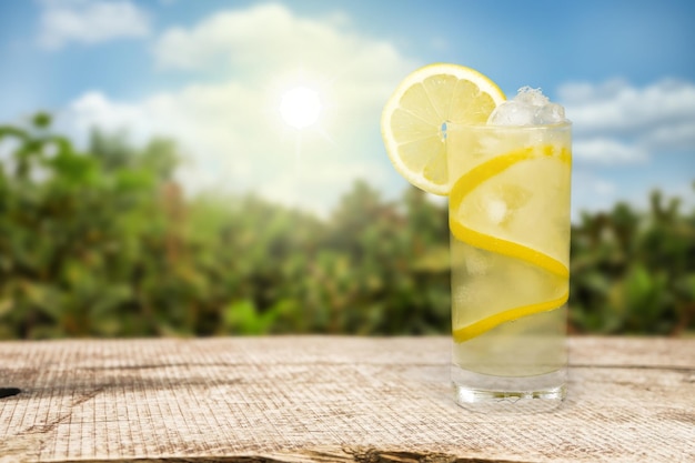 Lemonade with fresh slice lemon on desk