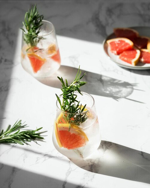 lemonade with grapefruit and rosemary Chiaroscuro from the window Light and shadows in food photo