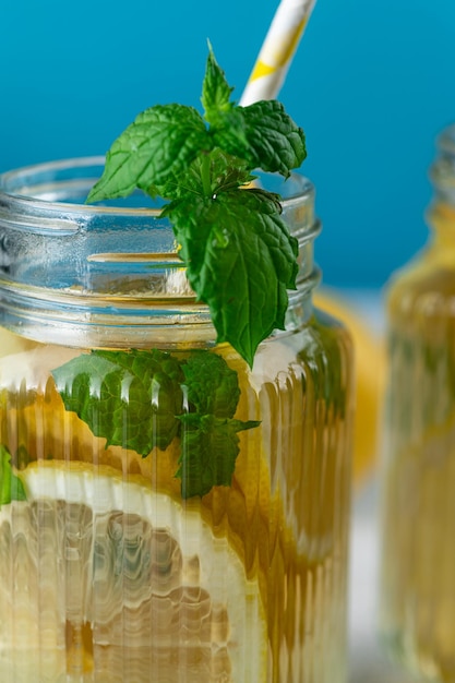 Lemonade with lemon slices ice and mint leaves