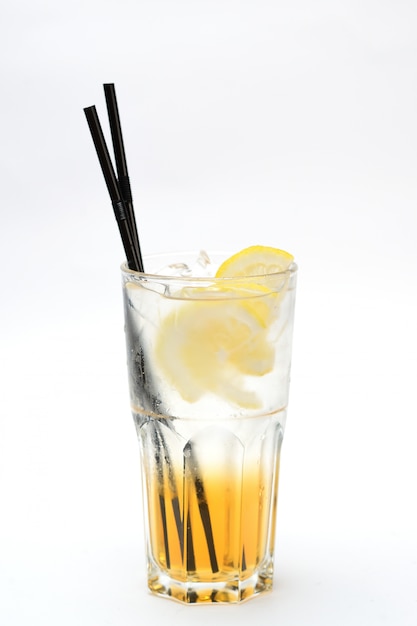 Lemonade with lemon and syrup in a transparent glass 