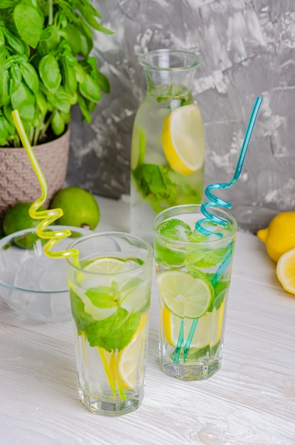 Lemonade with limes and mint in glasses