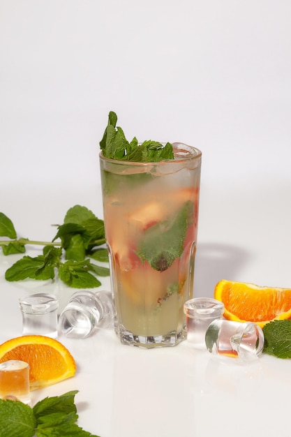 Lemonade with orange ginger leaves and mint served with ice