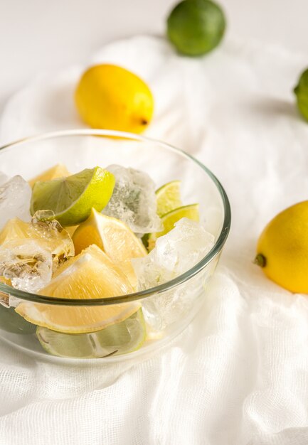 Photo lemons and limes on the white background