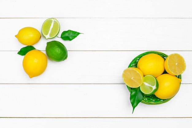 Lemons and limes on a wooden surface