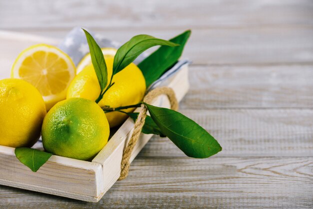 Lemons on old rustic natural wooden table