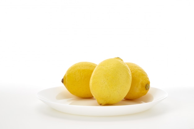 Lemons on a white plate