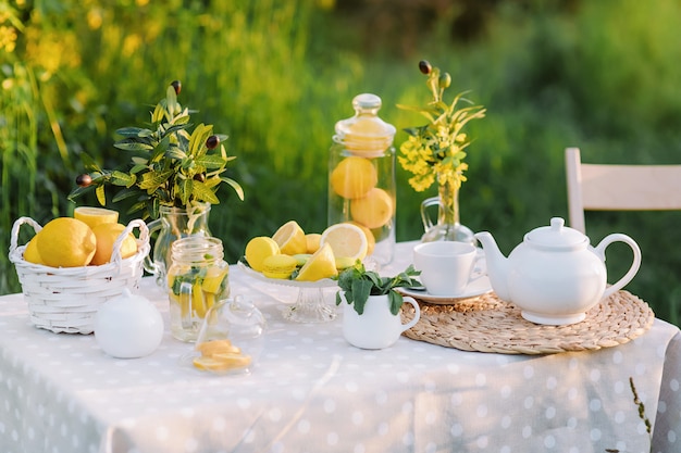 Lemons and yellow macaroons on the table sunset light