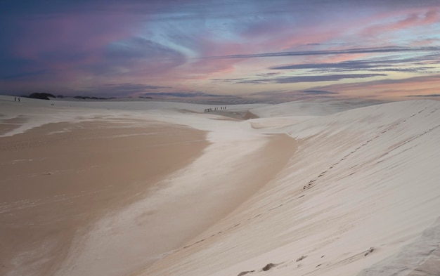 Lencois Maranhenses MA Brazil March 12th 2017 People walking in the desert dunes with water