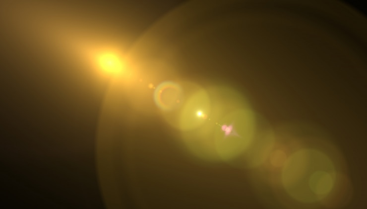 Photo  lens flare light on black background. easy to add overlay or screen filter over photos