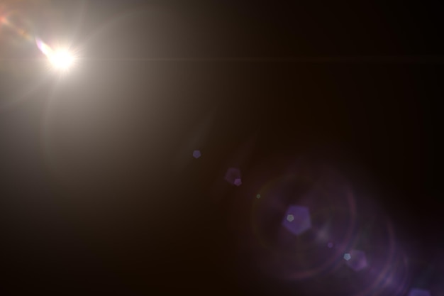 Lens Flare Sun Flare on black background Optical Flare effect illustration lens effects for overlay designs or screen blending mode Abstract sun burst digital flare iridescent glare