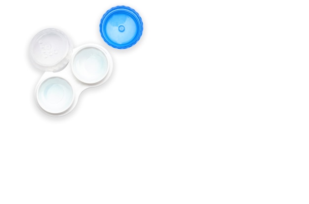 Lenses in a container on a white background isolated