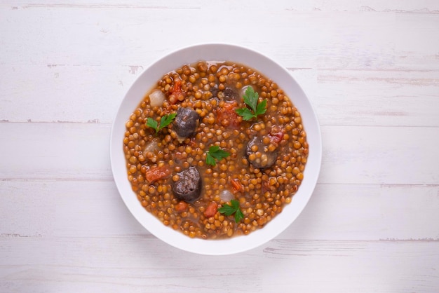 Lentil dish with potato chorizo and black pudding Traditional Spanish lentil stew with vegetables