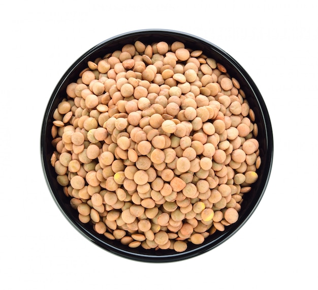 Lentils in a bowl on white space