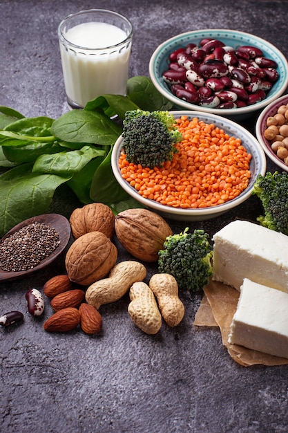 Photo lentils, chickpea, nuts, beans, spinach, tofu, broccoli and  chia seeds.