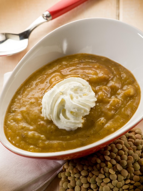 Lentils cream soup with yogurt cream vegetarian food