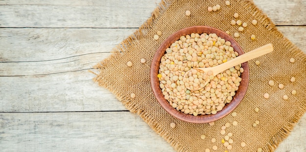 Lentils in teralke on the table. Selective focus.