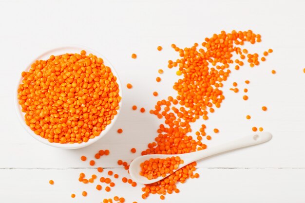 Lentils on white wooden background