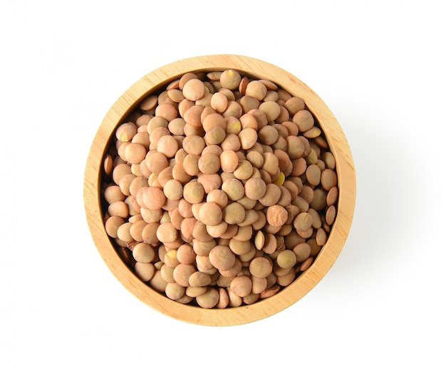 Lentils in wood bowl. isolated