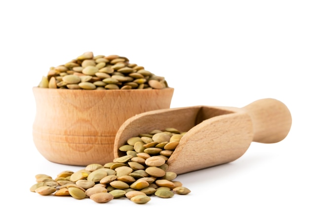 Lentils in wooden plate and spoon