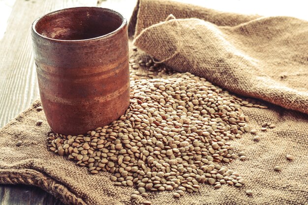 Lentils on a wooden rustic background