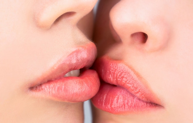 Lesbian couple kiss lips. Passion sensual touch.