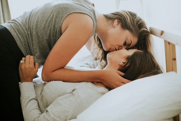 Lesbian couple kissing in the morning