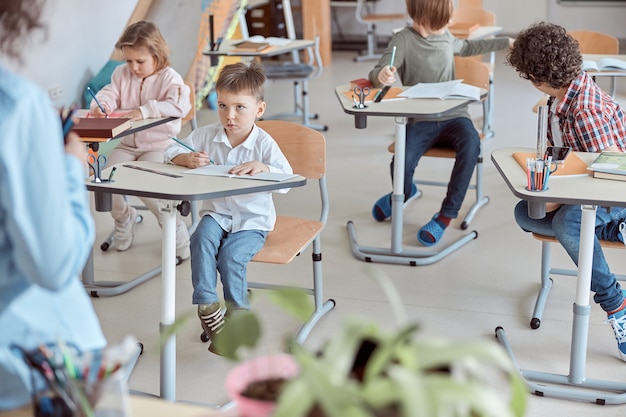 Lesson with adorable little students in elementary school