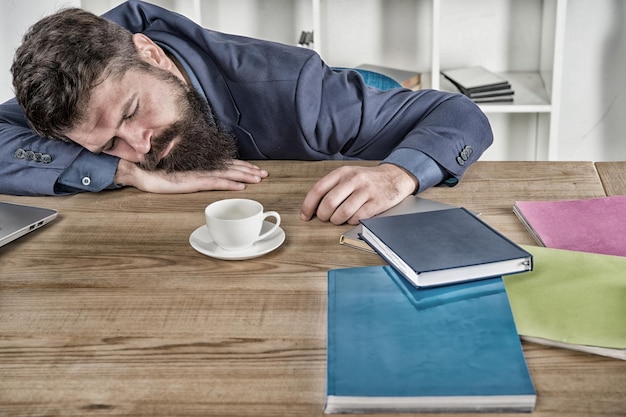 Photo let me relax man sleeping over workplace coffee will help me bored and exhausted guy sleep at work need break for relax being lazy tired businessman sleep in office boss fell asleep on table