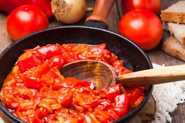 Letcho ingredients and dish in rustic pan