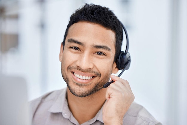 Lets get that problem sorted. Cropped portrait of a handsome young male call center agent working at his desk in the office.