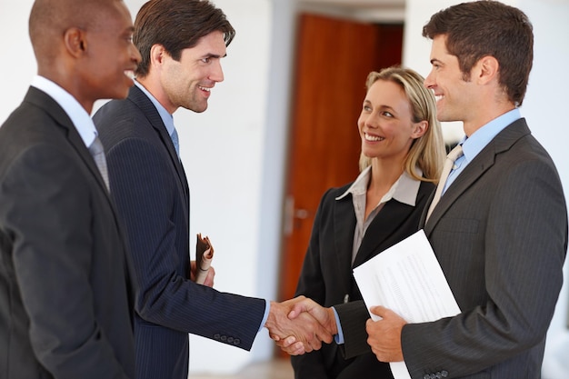 Lets get this show on the road Shot of two business colleagues shaking hands