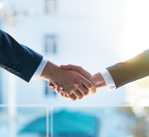 Lets shake on it Shot of two businesspeople shaking hands