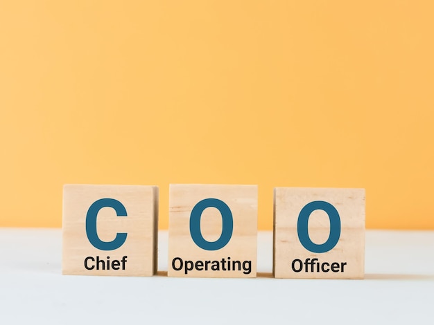 Letter of the alphabet of COO on wooden cubes.