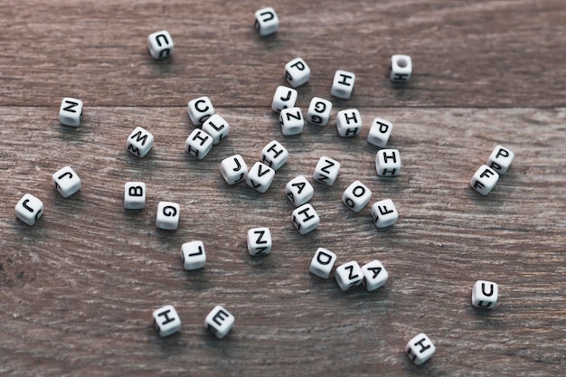 Letter cubes on wood background