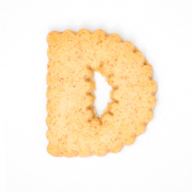 Letter D made of cracker cookie isolated on white background