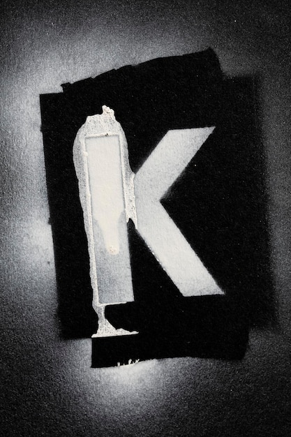Photo letter k grunge spray paninted stencil font