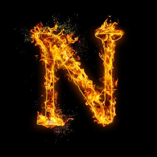 Letter N. Fire flames on black , realistic fire effect with sparks.