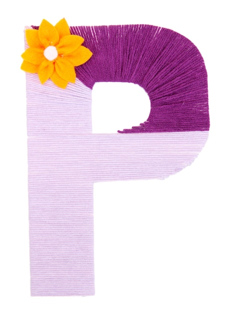 Letter P created with brightly colored knitting yard isolated on white