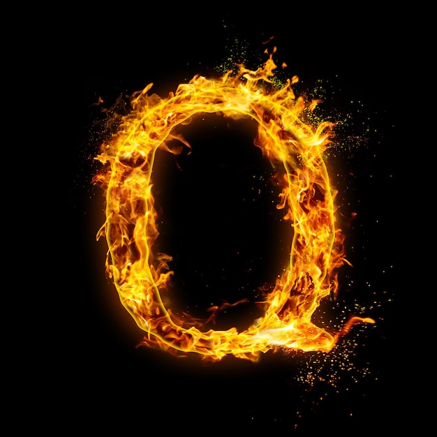 Photo letter q. fire flames on black , realistic fire effect with sparks.